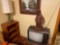 (2) Lamps, Wooden Figure, Table, TV, Dresser, And Book Shelf
