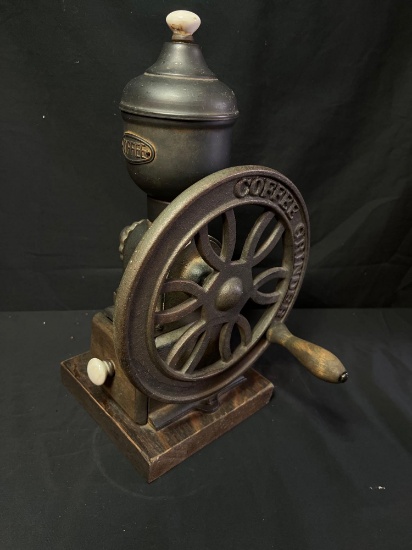 Hand crank coffee grinder on wood base