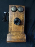 Antique wall phone with oak case, maker unknown
