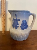 Blue and white stoneware pitcher with windmill