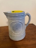 Blue and white stoneware pitcher with Indian