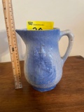 Blue and white stoneware pitcher with castle