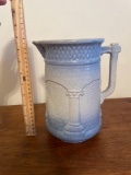 Blue and white stoneware pitcher with columns