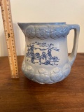 Blue and white stoneware pitcher with Dutch windmill scene
