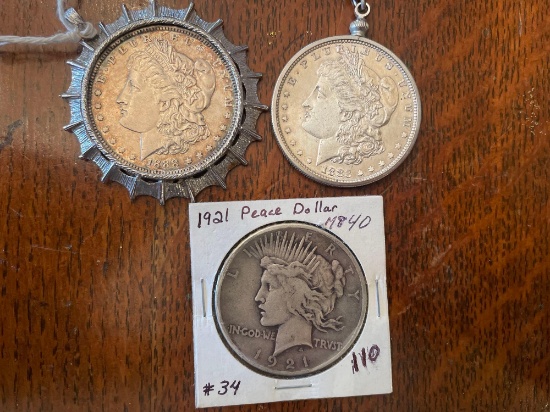 (2) Morgan silver dollars and one peace silver dollar