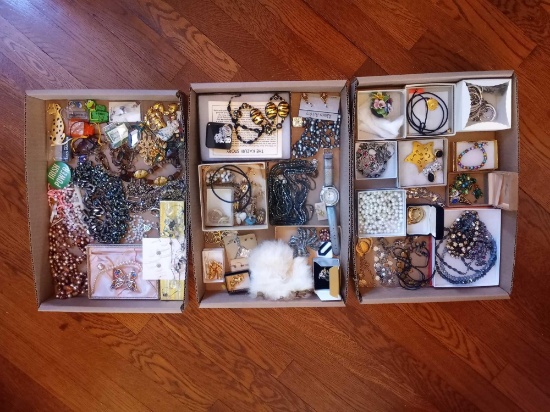 Assortment of costume jewelry - necklaces, earrings, pins, bracelets