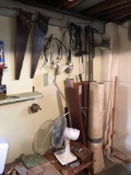 tools, lumber and hardware along basement wall