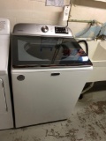 Newer Maytag top load washing machine.