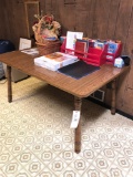 table, books, picture frames and baskets