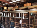 aluminum ladder and assorted yards tools and lumber