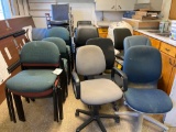 large group of assorted office chairs