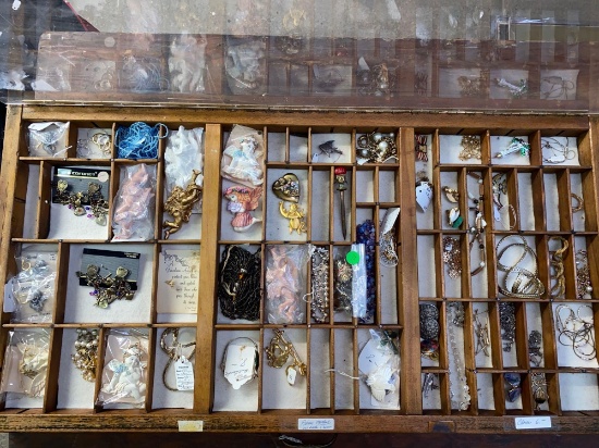 Showcase full of vintage and costume jewelry