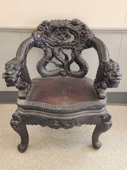 Profusely carved vintage Chinese dragon chair