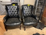 2 black leather like arm chairs with nailhead trim