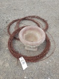 small pot, barbed wire rolls