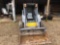 2001 New Holland LS160 super boom skid loader with material bucket, 2,583 hours