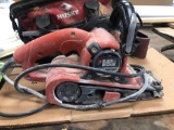 Black and Decker dragster sander, bag belts and tools in bag