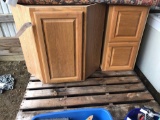 Two oak finish cabinets
