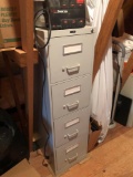 File cabinet and power surge protector