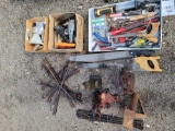 Lots of tools, pipe wrenches, hammers, tire irons, and more