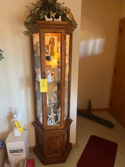 lighted mirrored back curio cabinet with contents