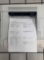 desktop laser printers with test pages printed out to verify print quality.
