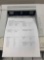 desktop laser printers with test pages printed out to verify print quality.