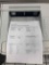 desktop laser printers with test pages printed out to verify print quality.