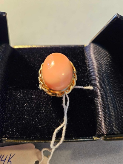 14k yellow gold lady's ring with large pink stone