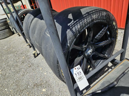 Set of 4 305/690-19 slick tires, mounted