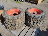 (4) 10-16.5 NHS skid steer wheels