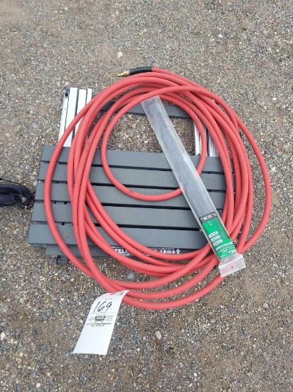 Metal folding stand and air hose.
