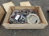 Wooden crate full of pumping hardware and air hoses.