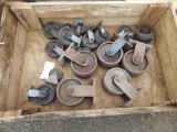 Wooden crate full of casters.