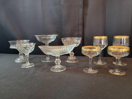 Assorted press glass compotes and gold rim drinking glasses