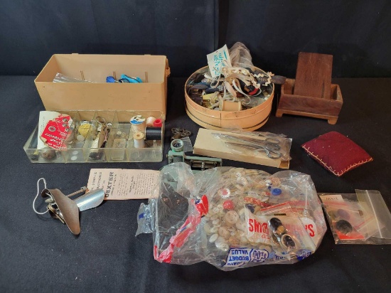 Group of vintage sewing items, pin cushion, buttons, stitcher