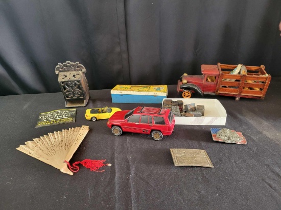 Metal match holder, busy boy tool chest, toy cars, wood truck, belt buckles