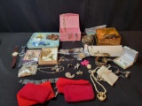 Box lot of assorted costume jewelry, necklaces, bracelets, brooches and more