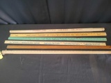 Group of advertising yard sticks, Ford, Chevy, and more