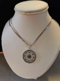 Lady's 14k white gold round pendant