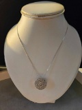 Lady's 14k white gold round filigree pendant