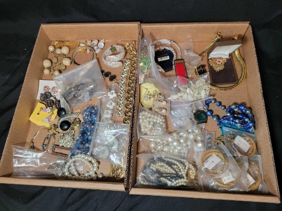 Group of assorted costume jewelry, pins, necklaces, brooches and earrings