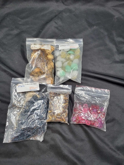 Group of plastic and glass bead, metal pieces for jewelry