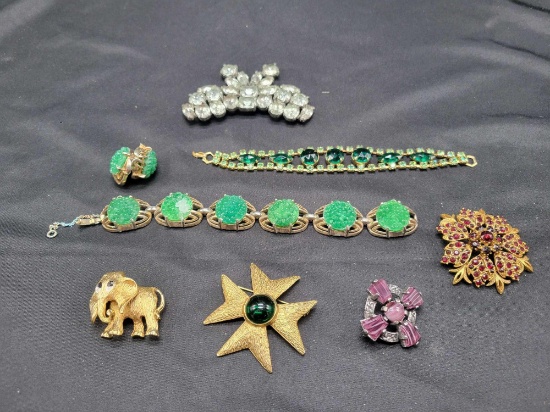 Group of gold tone and rhinestone brooches, necklaces and bracelet