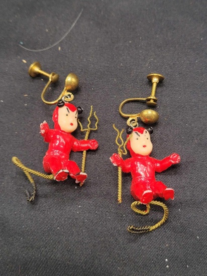 Pair of plastic devil themed earrings