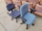 Pair of modern office chairs on casters