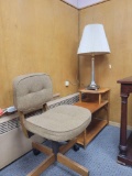 Modern upholstered office chair, beautiful lamp and step side table