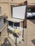 AV cart with monitors and mounted dry erase boards