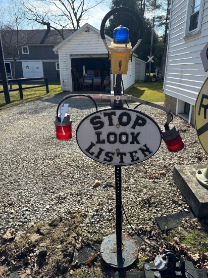 cast iron Stop Look Listen sign with lights