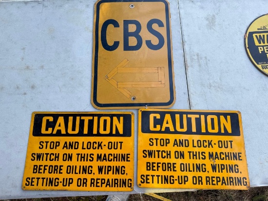 3 metal caution signs